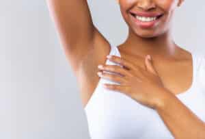 Woman with smooth underarms in after laser hair removal in Denver, CO