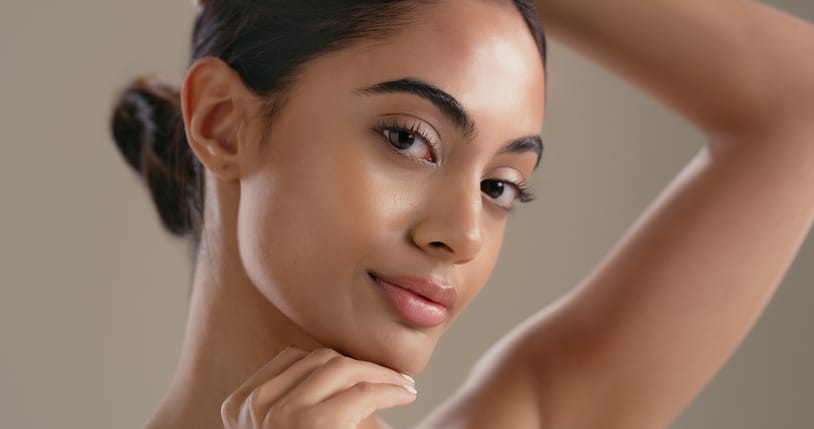 Woman showing the results of LED light therapy in Denver